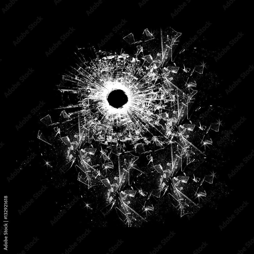 Shattered and broken glass pieces with hole isolated on black