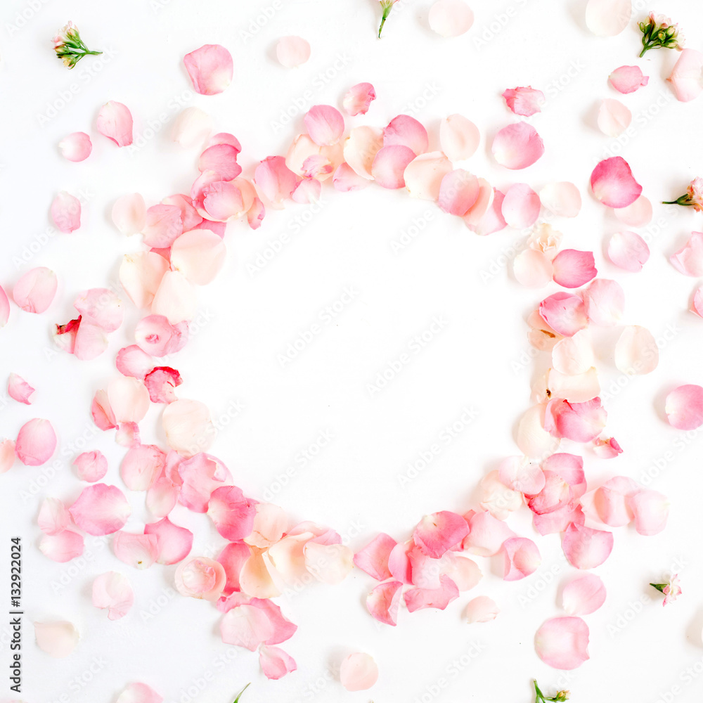 Frame made of pink roses petals on white background. Flat lay, top view. Valentine's background Frame made of pink roses petals on white background. Flat lay, top view. Valentine's background