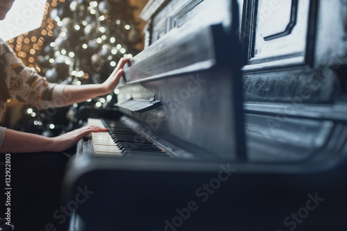 girl closes the old vintage piano cover © Dmitriy Shipilov