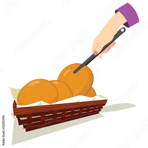 Female hand picking bun bread with kitchen tongs