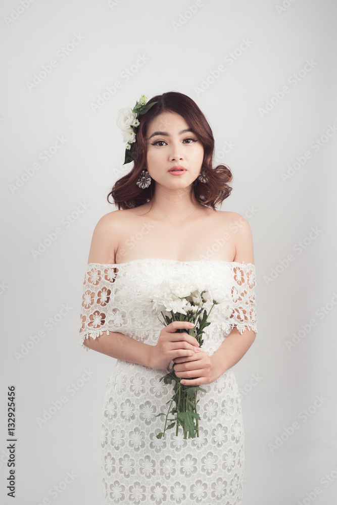 Beautiful asian woman bride on grey background Beautiful asian woman bride on grey background