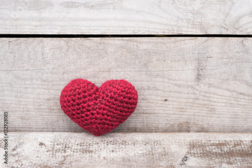 Crocheted heart on a grunge background