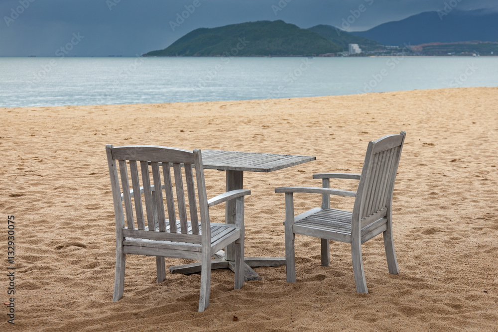 Two sitting place and table in a tropical beach