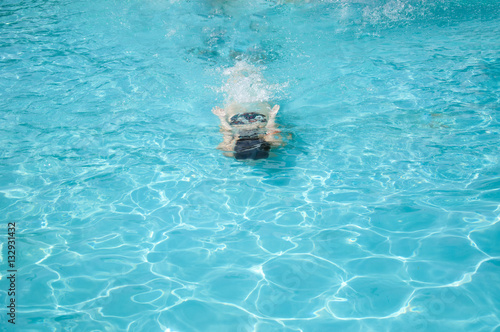 woman wimming under blue water