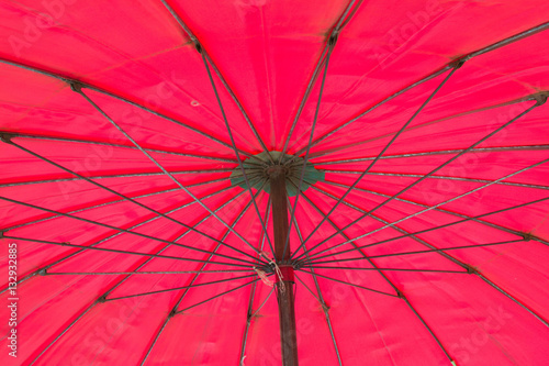 Red big umbrella inside background