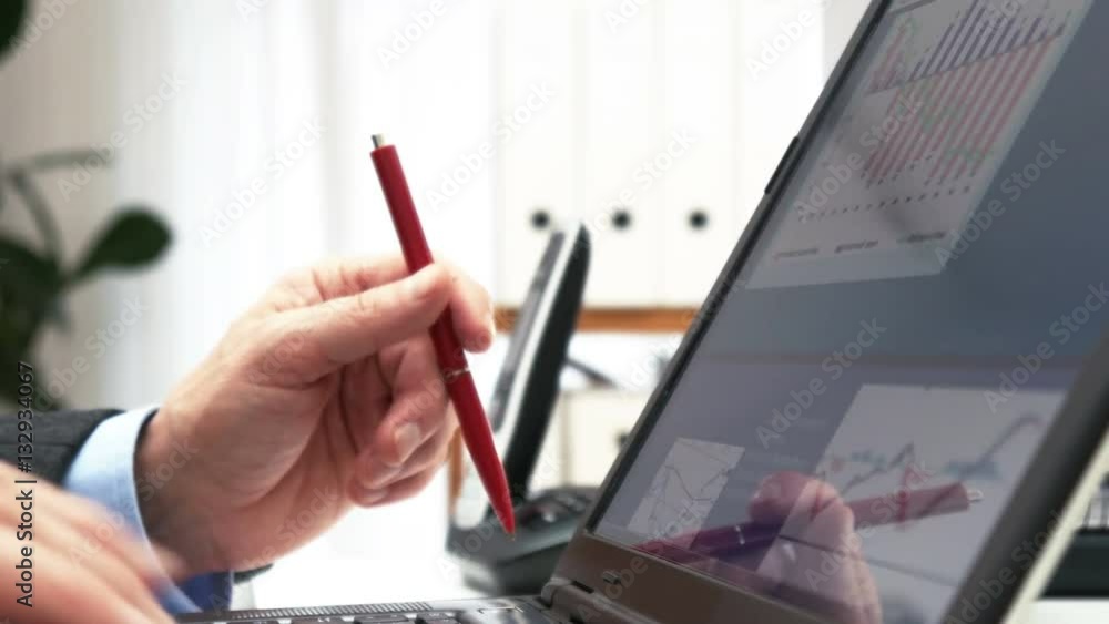 Businessman using calculator for stock market analysis - 4k Businessman using calculator for stock market analysis - 4k