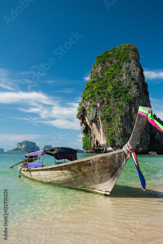 Colorful long tail boats at beautiful Ao Nang beach on a backgro © happystock
