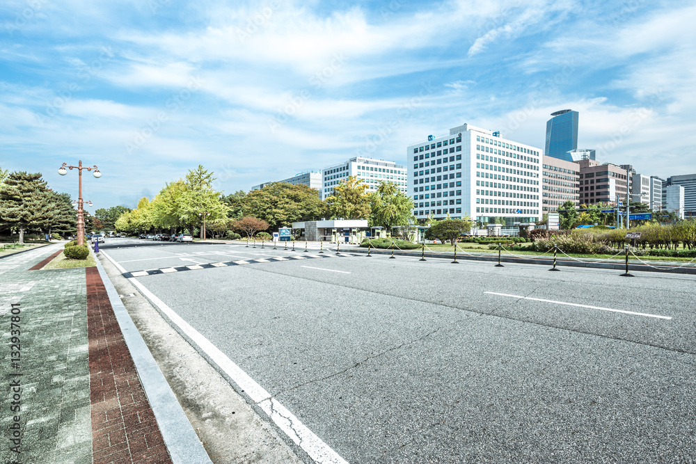 cityscape and skyline of seoul from empty road