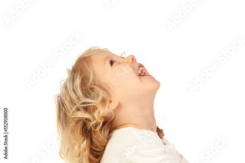 Portrait of playful small kid with long blond hair