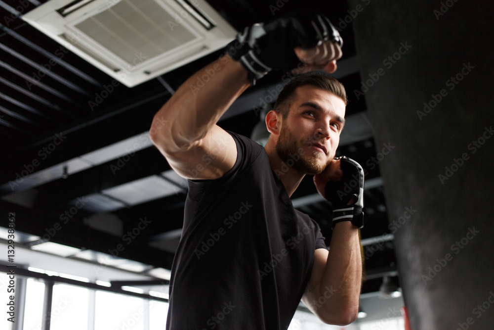 Male exercising in boxing gloves