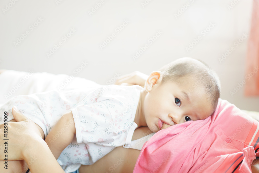 A year old Asian baby Breastfeeding A year old Asian baby Breastfeeding