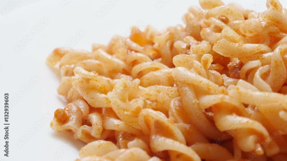 Spiral pasta served on plate close-up tilting 4K 2160p 30fps UltraHD footage - Slow tilt Girandole shaped pasta in tomato sauce Italian food 3840X2160 UHD video Spiral pasta served on plate close-up tilting 4K 2160p 30fps UltraHD footage - Slow tilt Girandole shaped pasta in tomato sauce Italian food 3840X2160 UHD video