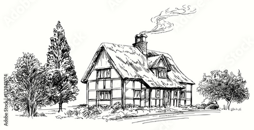 Valokuva Hand drawn vector illustration - thatched roof stone cottage in