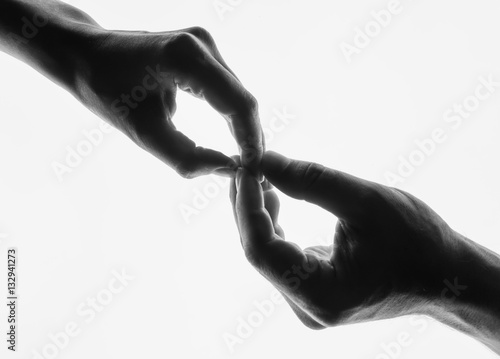 Man woman hold hands silhouette white background. Couple Holding Hands Closeup. Black and white photo