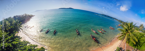 Shooting from air, a panorama on the beach with boats