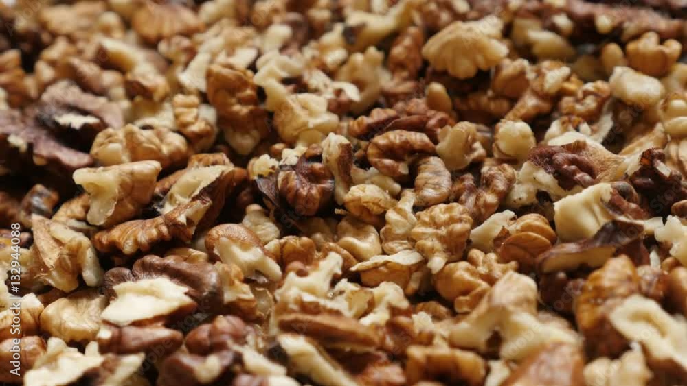 Low tilt on Juglans regia fruit ingredient pieces 4K 2160p 30fps UltraHD footage - Pile of walnut out its shell food background 3840X2160 UHD tilting video Low tilt on Juglans regia fruit ingredient pieces 4K 2160p 30fps UltraHD footage - Pile of walnut out its shell food background 3840X2160 UHD tilting video