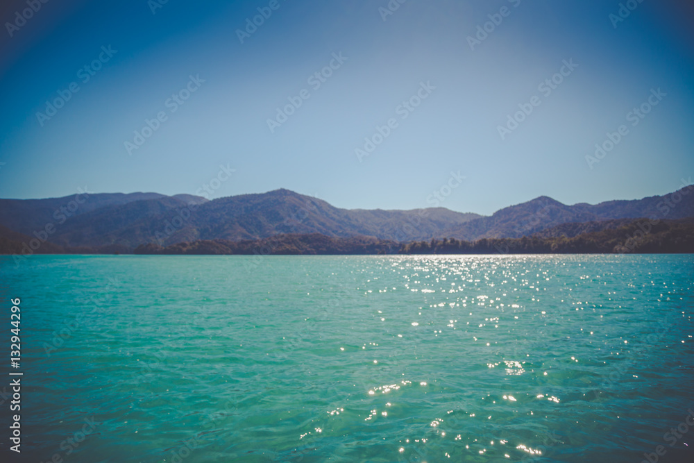 Beautiful dreamy ocean landscape with soft green hills of Abel Tasman National Park, New Zealand Beautiful dreamy ocean landscape with soft green hills of Abel Tasman National Park, New Zealand