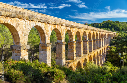 Fotografie, Tablou Les Ferreres Aqueduct, also known as Pont del Diable - Tarragona, Spain