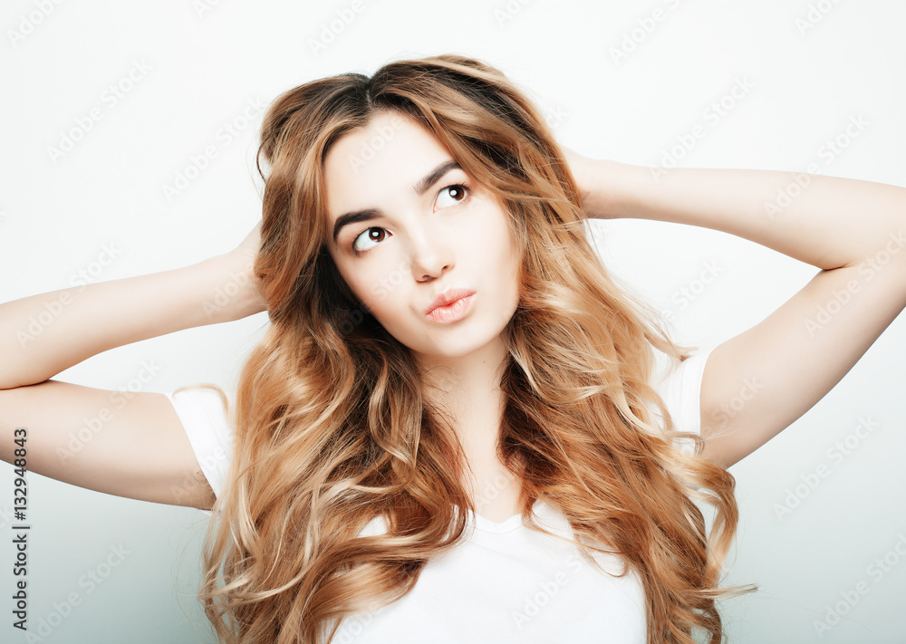 lifestyle and people concept: Young casual woman portrait. Clean face, curly hair. lifestyle and people concept: Young casual woman portrait. Clean face, curly hair.