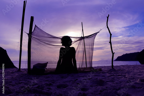 Woman camping alone on the beach at ang thong island.Thailand  photo