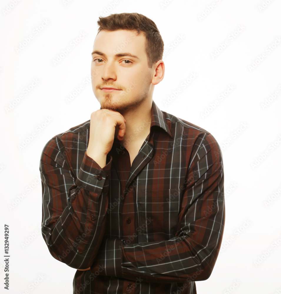 Handsome young man in shirt looking at camera Handsome young man in shirt looking at camera