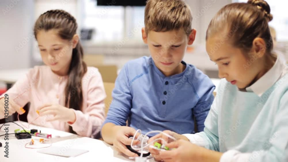 happy children learning at robotics school