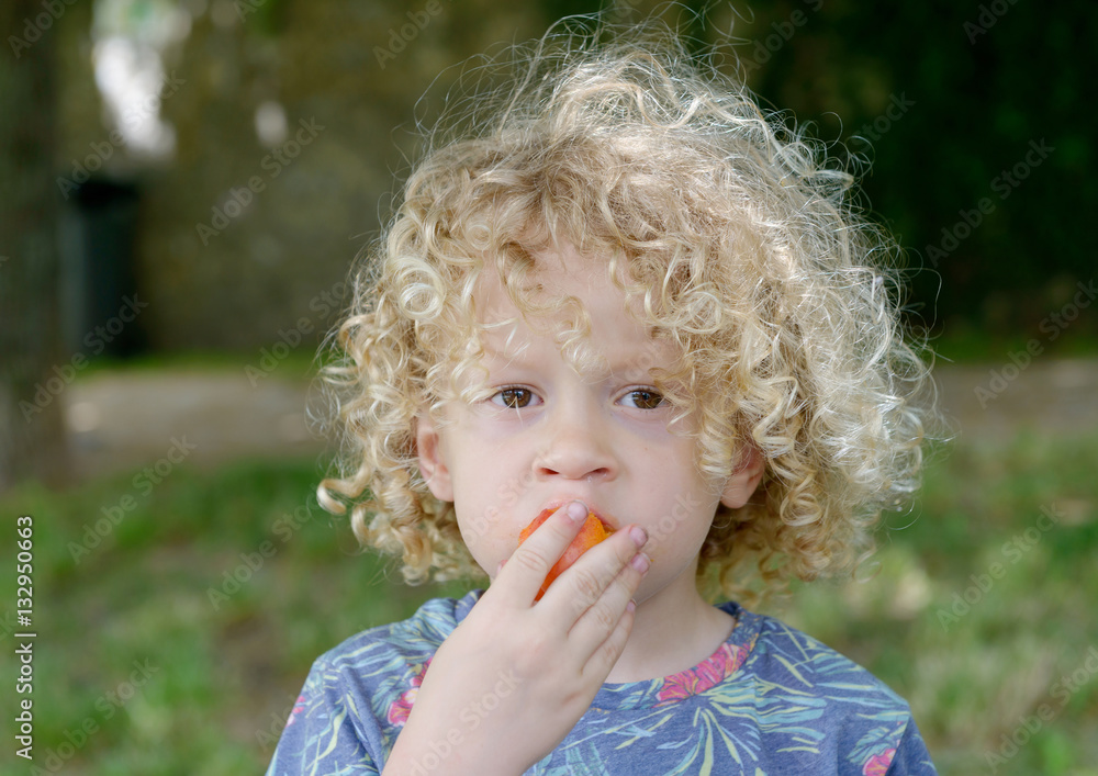 Portrait of little boy blond and curly Portrait of little boy blond and curly