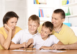 parents drawing with sons
