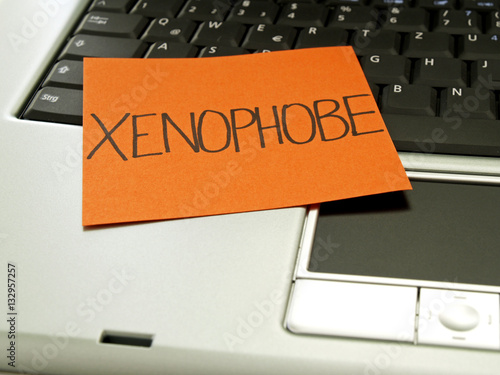 Memo note on notebook, xenophobe photo