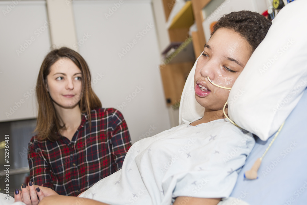 Sick patient lying on bed in hospital for medical background Sick patient lying on bed in hospital for medical background