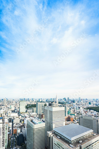 Business and culture concept - panoramic modern city skyline bird eye aerial view under dramatic sun and morning blue cloudy sky in Tokyo  Japan