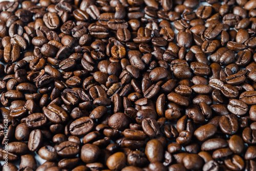Coffebeans on Neutral Gray Background. Dark Roast Coffee.