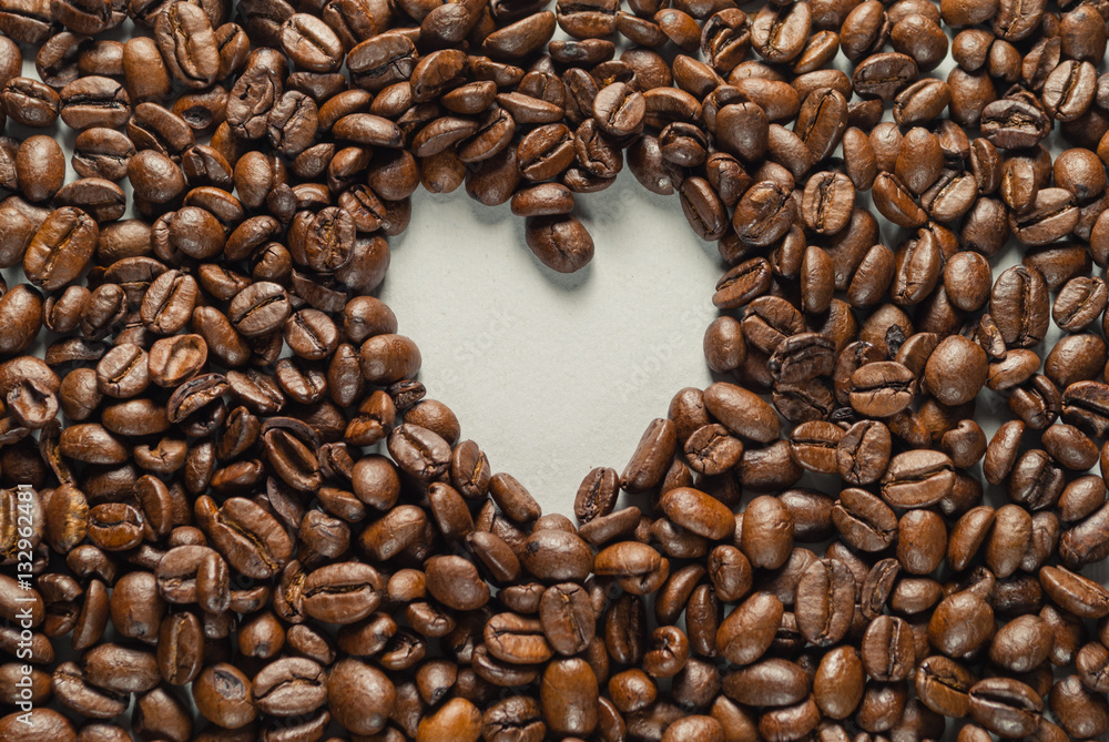 Coffebeans on Neutral Gray Background. Dark Roast Coffee. Heart. Coffebeans on Neutral Gray Background. Dark Roast Coffee. Heart.