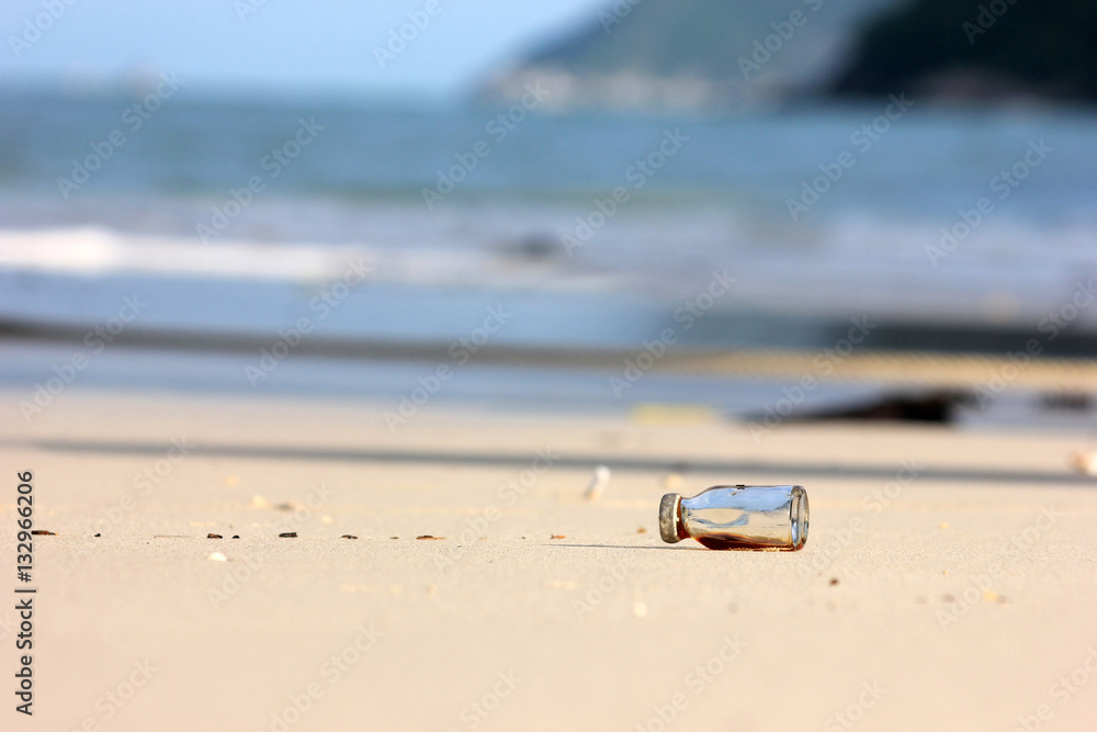 Medicine bottle with shade from the sun on the beach. Medicine bottle with shade from the sun on the beach.