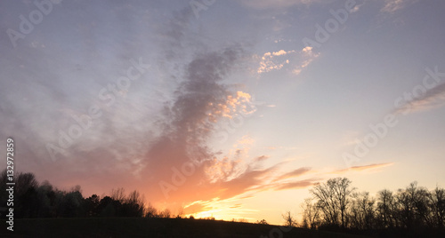 Sunset Over Darkened Landscape