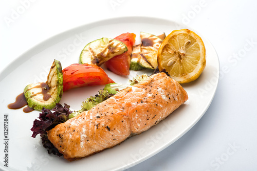 Fried salmon on a plate.