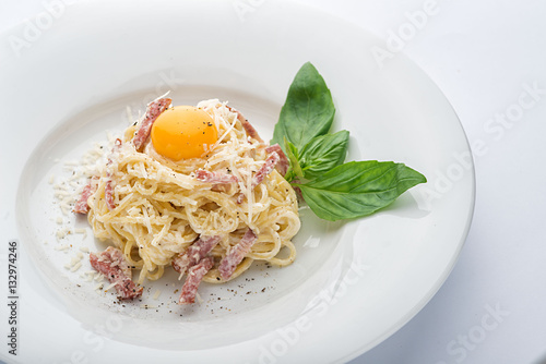 Pasta carbonara with egg.