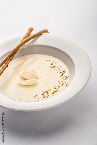Cream soup in a white plate.