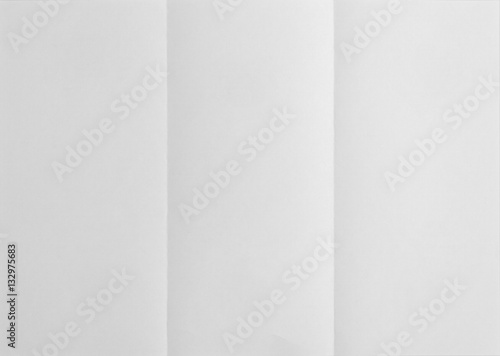 white sheet of paper folded in three