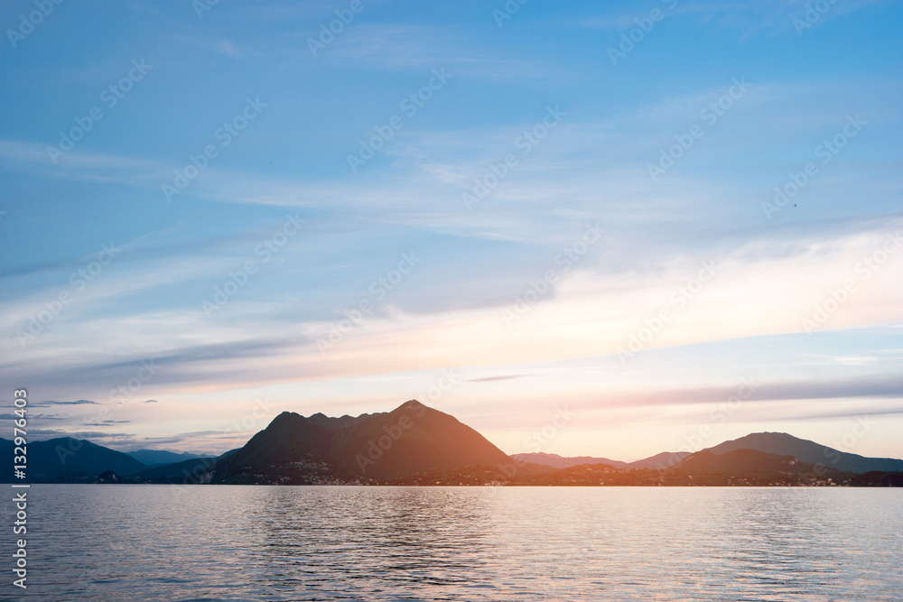 Water, sky and mountains. Landscape during sunset. Trip to Maggiore lake. Water, sky and mountains. Landscape during sunset. Trip to Maggiore lake.