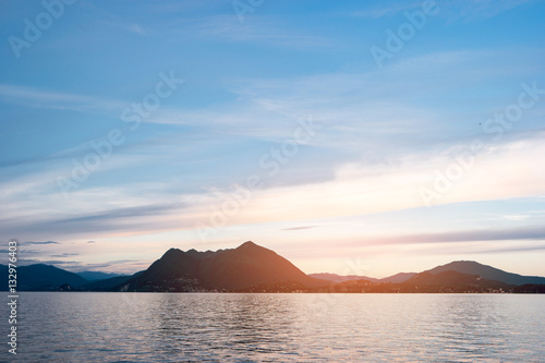 Water, sky and mountains. Landscape during sunset. Trip to Maggiore lake. © DenisProduction.com
