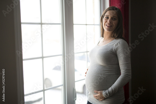 Free Download young pregnant woman close to the window - GFXLoad
