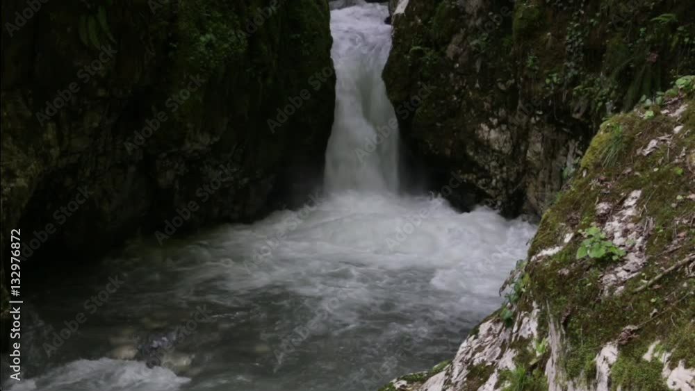 Waterfall in the rocks, the river flowing through a narrow crack, Abkhazia and the Caucasus. Bzyb River National Park Ritz. Waterfall in the rocks, the river flowing through a narrow crack, Abkhazia and the Caucasus. Bzyb River National Park Ritz.