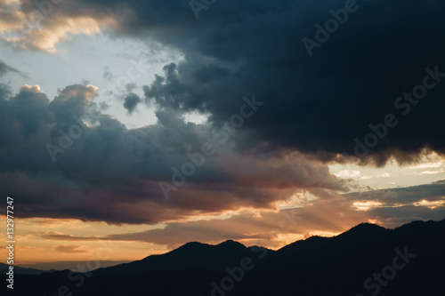 Sunset Behind Mountain in the rainy season