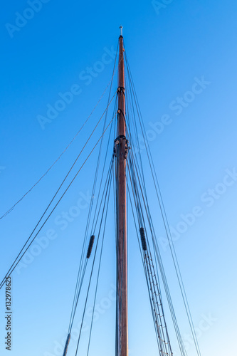 mast sailing yacht in the background of blue sky