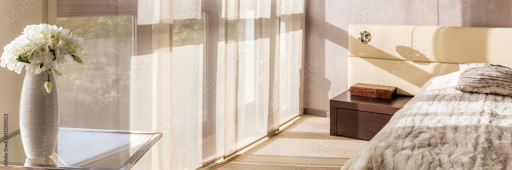 Light bedroom with glass table