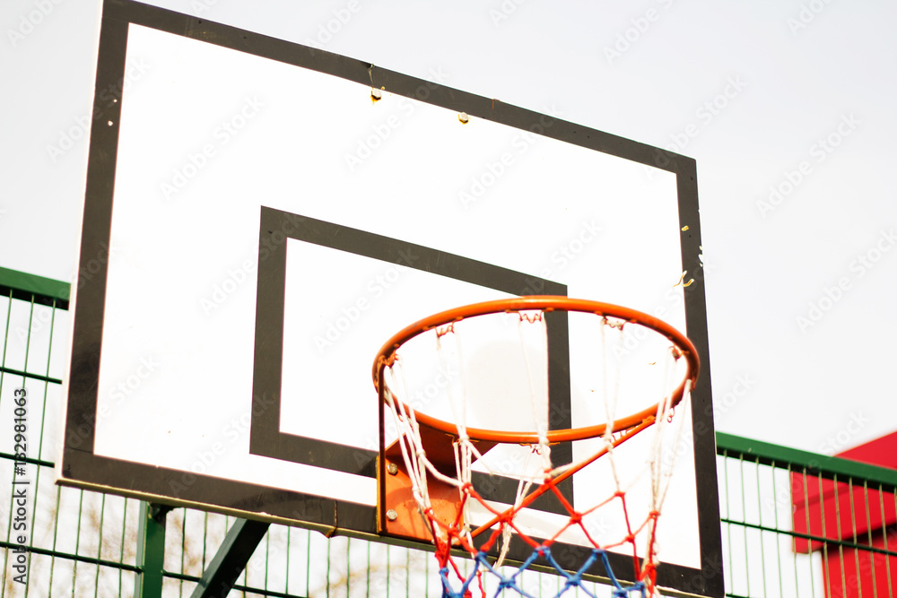Naklejka premium Basketball hoop in a school play area
