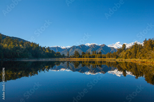 Reflections on Lake Matheson, New Zealand photo