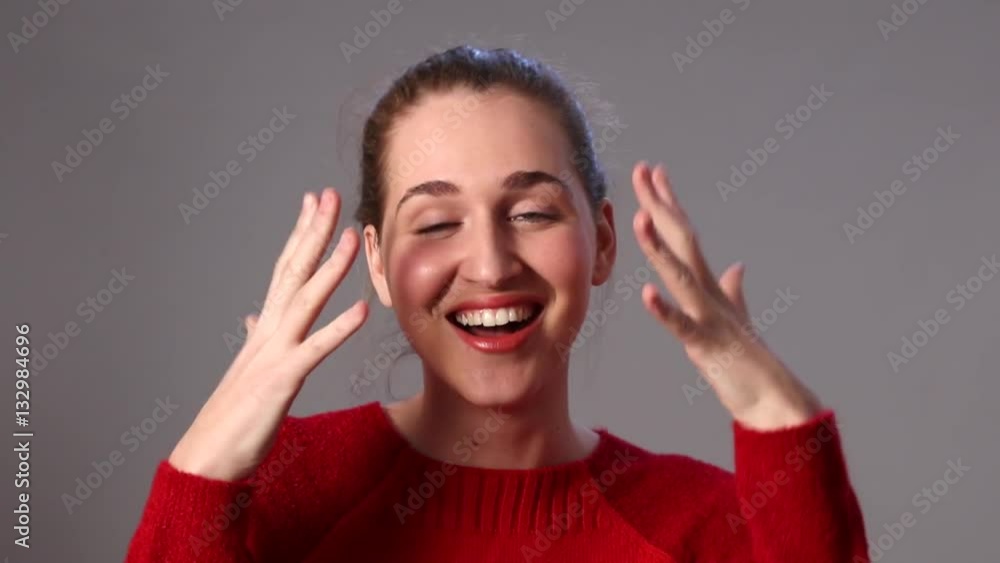 girly beautiful young woman laughing covering her thrilled face girly beautiful young woman laughing covering her thrilled face