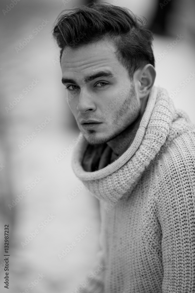 Obraz premium Portrait of a young man in sweater.